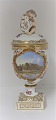 Lundin Antique presents: Royal Copenhagen. Porcelain egg vase with putti. Motif: Botanical Garden. Height 27 ...