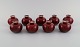 9 runde Rörstrand lysestager i glaseret fajance. Smuk glasur i bordeaux røde 
nuancer. 1960