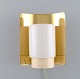 Hans Agne Jakobsson for A / B Markaryd. Wall lamp in brass and lacquered metal. 
Swedish design, 1960s / 70s.
