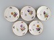 Royal Copenhagen Saxon Flower special version. Five rare cake plates with 
hand-painted flowers and gold decoration. Approx. 1900.

