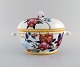 Porcelain of Paris. "Tropical Aurore". Porcelain lidded tureen decorated with 
flowers, pomegranates and bamboo. 1980s.
