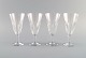 Baccarat, France. Four art deco champagne flutes in clear mouth-blown crystal 
glass. 1930s.
