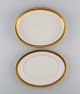 Royal Copenhagen service no. 607. Two oval porcelain dishes. Gold border with 
foliage. 1940s.

