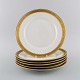 Royal Copenhagen service no. 607. Six porcelain dinner plates. Gold border with 
foliage. Model number 607/9586. Dated 1944.

