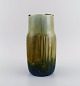 Valdemar Engelhardt (1860-1915) for Royal Copenhagen. Unique porcelain vase. 
Beautiful crystal glaze. Approx. 1900.
