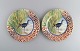 Gien, France. Two Savane porcelain plates with hand-painted exotic birds. Late 
20th century.
