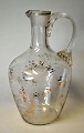 Antique clear glass jug with etched flowers and gilding, ...