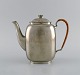 Just Andersen (1884-1943), Denmark. Art deco tin coffee pot with wicker handle. 
1940s. Model number 2421.

