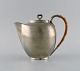 Just Andersen (1884-1943), Denmark. Art deco tin coffee pot with wicker handle. 
1940s. Model number 2272.
