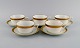 Royal Copenhagen service no. 607. Five teacups with saucers. Gold border with 
foliage. 1960s. Model number 607/9536.
