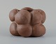 Christina Muff, Danish contemporary ceramicist (b. 1971). 
Dark brown unglazed vessel. Organic shaped vase with lips. Clear glaze inside.