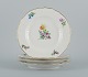 Royal Copenhagen Saxon Flower. Four dinner plates in hand-painted porcelain with 
flowers and gold decoration.