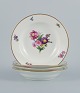 B&G, Bing & Grondahl Saxon flower.
Four deep plates decorated with flowers and gold rim.