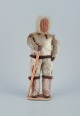 Greenlandica. Wooden figure. Inuit in traditional clothes.