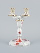 Herend, Hungary, two-armed porcelain footed candlestick, hand-painted with 
orange flowers.
