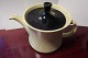 Teapot made of porcelainYellow with a black lid, and ...