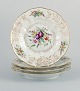 Royal Copenhagen, a set of four antique dinner plates with reticulated rim and 
leaf work.