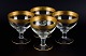 Rimpler Kristall, Zwiesel, Germany, four mouth-blown crystal champagne glasses 
with gold rim decorated with grapes and vine leaves.