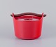 Timo Sarpaneva for Rosenlew, Finland, cast iron pot in red enamel with a wooden 
handle.