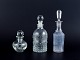 Danish glassworks, three oil/vinegar jugs in different designs. Clear glass.