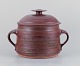 Mogens Nielsen, Nysted, Denmark, colossal handmade lidded jar in ceramic with 
glaze in brown tones.
