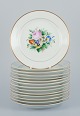 Bing & Grondahl, a set of fourteen plates hand-painted with various polychrome 
flower motifs and gold trim.