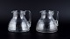 Baccarat, France, two "Charmes" Art Deco pitchers in clear crystal glass. 
Faceted cut.