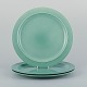 Royal Copenhagen, "4 All Seasons". A set of three dinner plates in faience with 
green glaze.