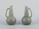 Gunnar Nylund for Rörstrand, Sweden. A pair of Ritzi ceramic pitchers with green 
glaze.