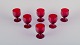 Monica Bratt for Reijmyre, Sweden. A set of six small wine glasses in 
mouth-blown wine red art glass.