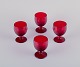 Monica Bratt for Reijmyre, Sweden. A set of four small wine glasses in 
mouth-blown wine red art glass.