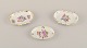 Herend, Hungary. Three small oval bowls hand-painted with polychrome flower 
motifs and gold decoration.