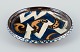 Kähler ceramic dish in cohorn technique. Abstract motif with glaze in blue, 
yellow, and white tones.