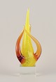 Swedish glass artist. Large sculpture in art glass.
Yellow and amber decoration on a square base in clear glass. Mouth-blown.