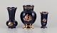 Limoges, France. Three porcelain vases decorated with 22-karat gold leaf and 
beautiful royal blue glaze. Scène galante.