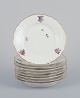 Royal 
Copenhagen 
Saxon Flower. 
Nine porcelain 
plates. ...