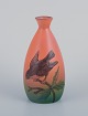 Ipsens Enke, keramikvase, motiv af fugl på gren. Glasur i grønne og orange 
toner.