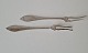 Karstens Antik 
presents: 
Empire 
pair of cold 
cut forks in 
silver from 
1909