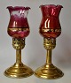 Pegasus – Kunst - Antik - Design presents: A pair of hurricanes in brass with red glass, approx. 1900. Probably ...