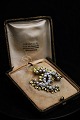 Vintage Chanel signature brooch CC in gold-plated metal with small pearls...