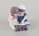 Bing & Grondahl, Denmark.
Porcelain figurine of reading children.