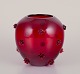 Monica Bratt. Art glass vase in dark red glass.