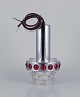 RAAK, Holland. Designer lamp in chrome, red plastic, and clear glass.
