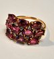 18k red gold 
ring with pink 
tourmalines and 
brilliants. ...