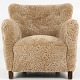 Unknown
Armchair 
upholstered in 
'Honey' 
lambskin and 
...