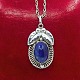 An art Nouveau necklace in silver set with lapis lazuli