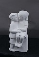 Stone Art white figurine from Marbell, The 
Netherlands. Couple of siblings on a bench.