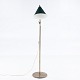 Roxy Klassik 
presents: 
Poul 
Dinesen / TH 
Valentiner.
Brass floor 
lamp with green 
shade.
1 pc. in stock
