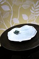 K&Co. presents: 
Royal 
Copenhagen 
porcelain 
figurine of a 
small frog 
sitting on a 
water lily 
leaf. RC# 
2477...