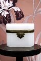 K&Co. presents: 
Antique, 
19th century 
sugar box in 
white opal 
glass with 
bronze 
mounting...